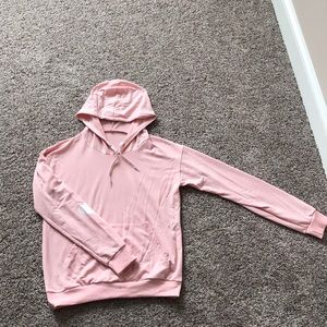 Pink sweater with hoddie and hearts in elbow